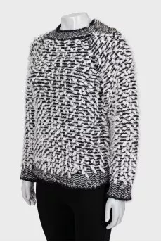 Knitted sweater decorated with buttons