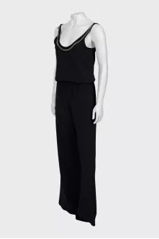 Black jumpsuit decorated with chain