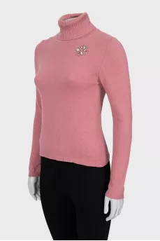 Knitted golf shirt decorated with rhinestones
