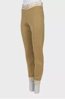 Gold joggers with signature logo