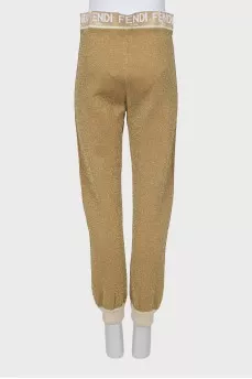 Gold joggers with signature logo