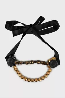 Necklace with golden beads