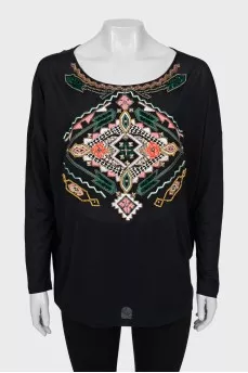 Blouse decorated with embroidery and beads