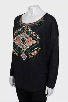 Blouse decorated with embroidery and beads