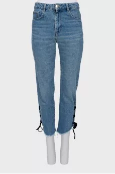 Blue jeans decorated with ties
