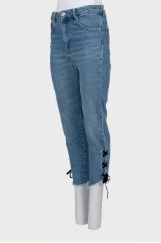Blue jeans decorated with ties