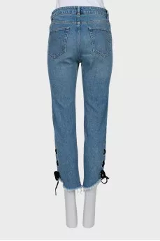 Blue jeans decorated with ties