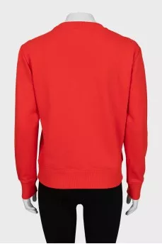 Red sweatshirt with embossed print