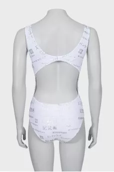 One-piece swimsuit with text print and tag