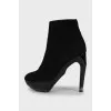 Suede ankle boots with figured heels