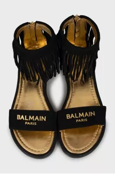 Suede sandals decorated with fringes
