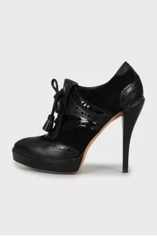 Perforated leather and suede ankle boots