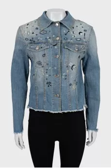 Denim jacket decorated with beads