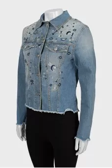Denim jacket decorated with beads