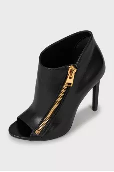 Ankle boots with golden zipper