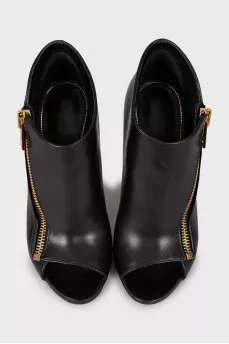 Ankle boots with golden zipper