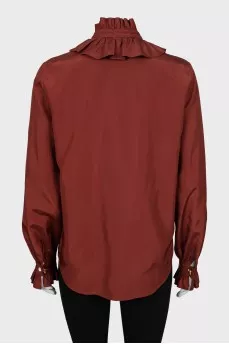 Shirt decorated with frills