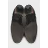 Black patent leather brogues