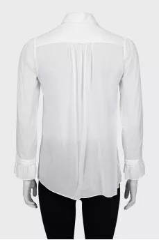 Sheer blouse with ruffled cuffs