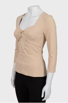 Fitted blouse with raised seams