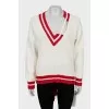 Knitted pullover with tag