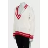 Knitted pullover with tag