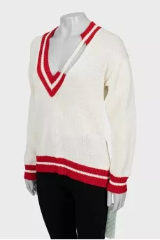 Knitted pullover with tag