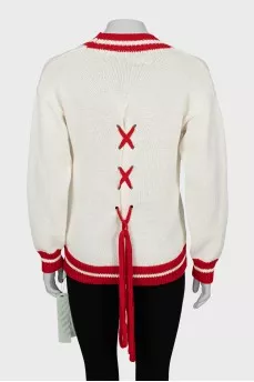 Knitted pullover with tag