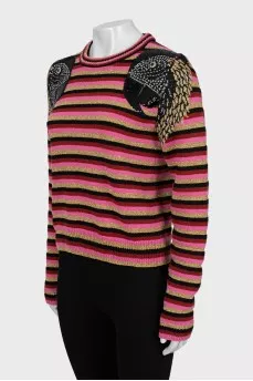 Striped sweater decorated with embroidery