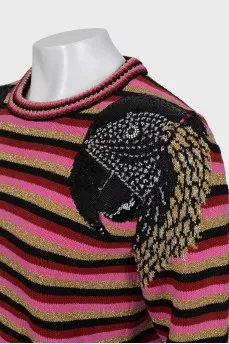 Striped sweater decorated with embroidery