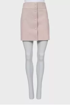 Suede miniskirt with snap buttons and tag