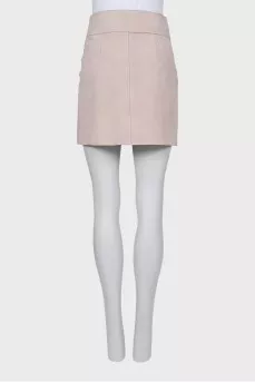 Suede miniskirt with snap buttons and tag
