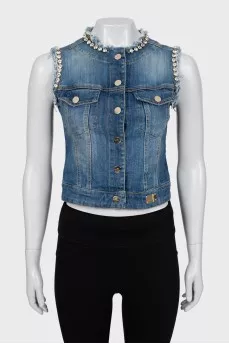Denim vest decorated with rhinestones
