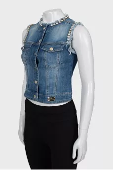 Denim vest decorated with rhinestones