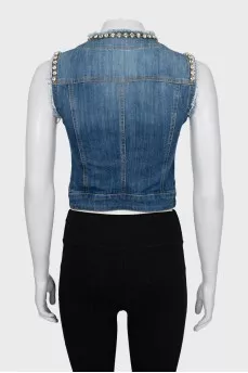 Denim vest decorated with rhinestones