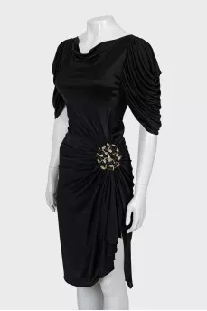 Black dress decorated with drapery