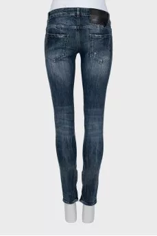 Tapered jeans with faded zip bottom