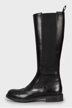 Leather boots decorated with perforations