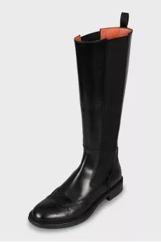 Leather boots decorated with perforations