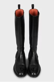Leather boots decorated with perforations