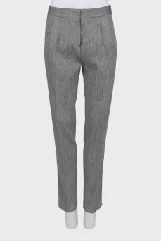 Trousers with arrows in fine print