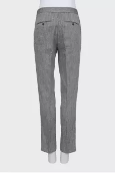 Trousers with arrows in fine print