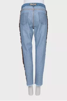 Jeans with buttons, seams facing out