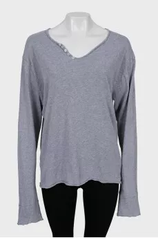 Gray long sleeve with a patch on the back
