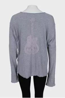 Gray long sleeve with a patch on the back