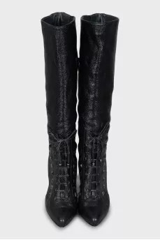 Patent leather boots decorated with spikes