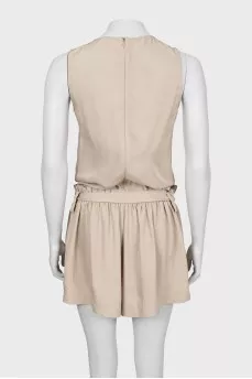 Beige jumpsuit with ruffles