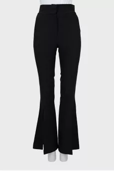 Flared trousers with slits at the bottom