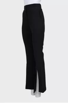 Flared trousers with slits at the bottom