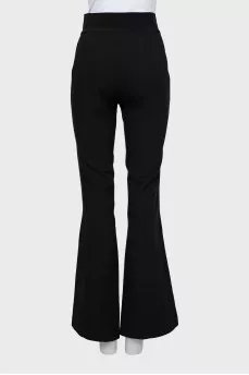 Flared trousers with slits at the bottom